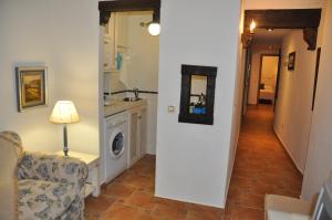 Kuchyňa alebo kuchynka v ubytovaní Apartamentos Boutique Doña Maria La Brava