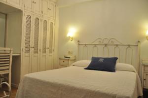 Posteľ alebo postele v izbe v ubytovaní Apartamentos Boutique Doña Maria La Brava