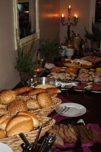 a buffet of bread and pastries on a table at Hotel Andreis in Cavaion Veronese