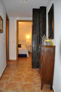 Posteľ alebo postele v izbe v ubytovaní Apartamentos Boutique Doña Maria La Brava