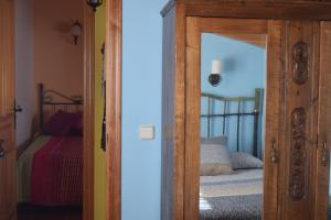 Llit o llits en una habitació de Casa Rural Abuelo Adón