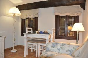 Posedenie v ubytovaní Apartamentos Boutique Doña Maria La Brava