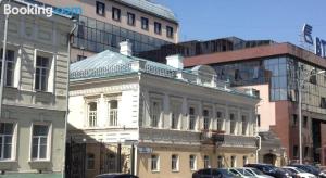 a white building on a city street with buildings at RedLine center in Yekaterinburg
