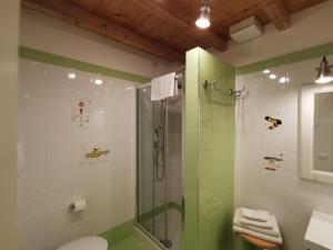 a bathroom with a shower and a toilet and a sink at B&B Re Umberto in Milazzo