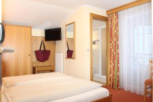מיטה או מיטות בחדר ב-Der Sailer Hotel & Restaurant