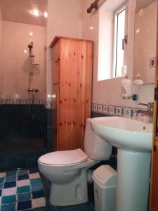 a bathroom with a toilet and a sink at Entire Senglea Seaview Town house in Senglea