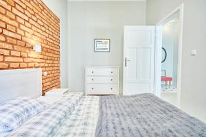 Posteľ alebo postele v izbe v ubytovaní 3D WYGODA Apartamenty