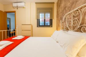 Posteľ alebo postele v izbe v ubytovaní Puerta San FELIX free parking by Cadiz4Rentals