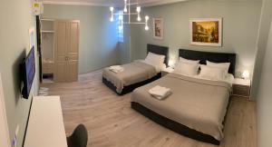 Postel nebo postele na pokoji v ubytování BELUX HOTEL
