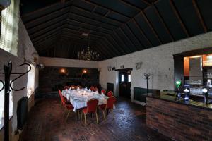 a large room with a large table and chairs at The Inn At Lathones in St Andrews