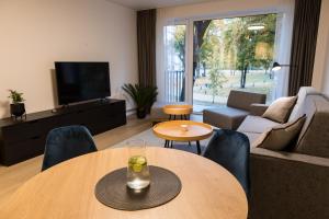 TV a/nebo společenská místnost v ubytování Apartment Hotel Laisve