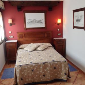 Cama o camas de una habitación en Hospedería Ana Pilar