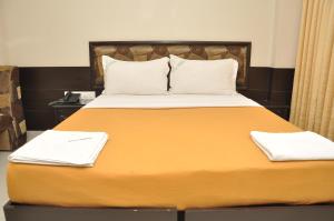 Ένα ή περισσότερα κρεβάτια σε δωμάτιο στο City Home