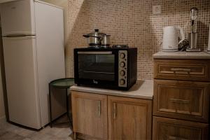 A kitchen or kitchenette at Your apartment in Athens (Next to Metro & Acropolis)