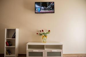 A television and/or entertainment centre at Your apartment in Athens (Next to Metro & Acropolis)
