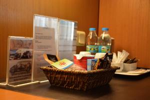 a basket of food and drinks on a table at Surmeli Istanbul Hotel in Istanbul