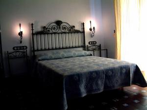 Łóżko lub łóżka w pokoju w obiekcie Hacienda Rural Molino Viejo