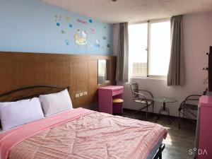 Postel nebo postele na pokoji v ubytování Sheng Feng Homestay