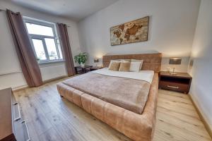 A bed or beds in a room at Le Monde Apartment Bratislava - amazing 5BDR in downtown