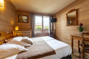 Postel nebo postele na pokoji v ubytování Hôtel La Montagne
