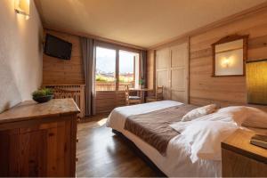 Postel nebo postele na pokoji v ubytování Hôtel La Montagne
