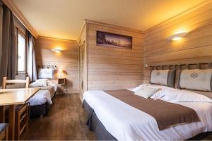 Postel nebo postele na pokoji v ubytování Hôtel La Montagne
