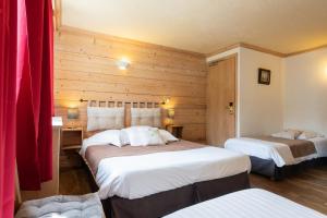 Postel nebo postele na pokoji v ubytování Hôtel La Montagne