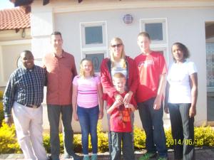a group of people standing in front of a house at Kingdoms Place Guesthouse in Ga-Luka