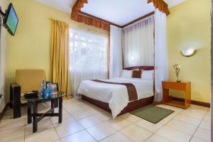Postel nebo postele na pokoji v ubytování Convent International Hotel- Nairobi
