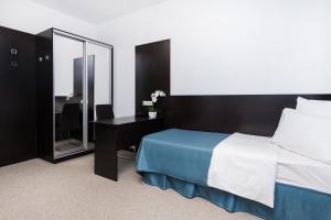 Кровать или кровати в номере Отель Силуэт