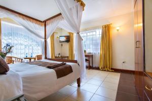 Postel nebo postele na pokoji v ubytování Convent International Hotel- Nairobi