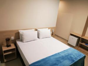 Ένα ή περισσότερα κρεβάτια σε δωμάτιο στο Pousada Montanhas do Caparaó