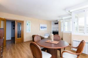 a living room with a table and chairs at Cala Bona Calm & Beach in Son Servera