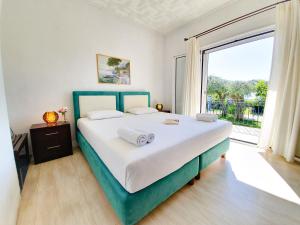 Posteľ alebo postele v izbe v ubytovaní Giovanni Group Apartments