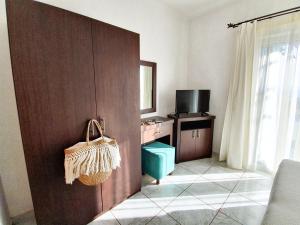 Televízia a/alebo spoločenská miestnosť v ubytovaní Giovanni Group Apartments