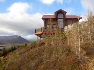a house on the top of a hill at Family Home in Fáskrúðsfjörður