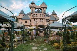 a castle with a pathway in front of a building at Royal Valentina Castle in Ognyanovo +200 photos
