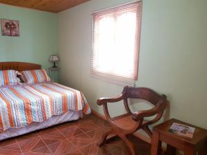 מיטה או מיטות בחדר ב-CASA GUADALUPE SAN FELIPE