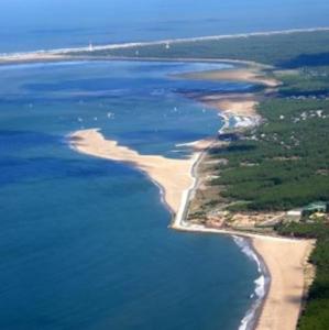 an aerial view of an island in the water at Camping la Palmyre in Les Mathes