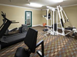 a room with a gym with several tread machines at InTown Suites Extended Stay Marietta GA - Town Center in Kennesaw