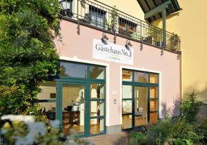 a building with a sign for a restaurant at Gästehaus No. 3 in Simmern