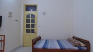 Postel nebo postele na pokoji v ubytování Homestay Nam Dong