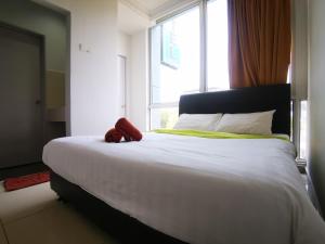 מיטה או מיטות בחדר ב-Clover Hotel Port Dickson