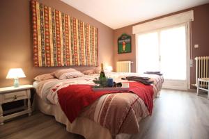 Un pat sau paturi într-o cameră la La Casita del Pirineo