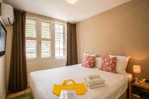 Łóżko lub łóżka w pokoju w obiekcie Boutique Hotel 't Klooster