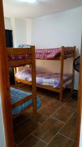 Giường trong phòng chung tại Complejo Solanas