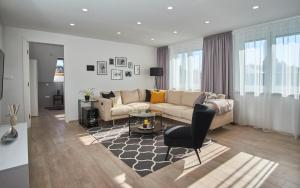 a living room with a couch and a table at Apartman Rafi in Čakovec