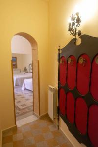 a room with a bedroom with a bed and an archway at ERCTA in Palermo