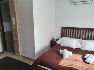 A bed or beds in a room at Duna Dráva Vendégház