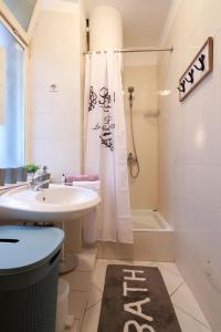a bathroom with a sink and a toilet and a shower at Retreat in Rijeka +31 photos